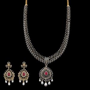 Buy 18 Karat Gold & Diamond Necklace Set